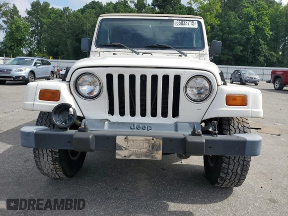 1999 Jeep Wrangler Sahara z VIN 1J4FY49S0XP432968, wystawiony jako Copart lot #65033715 z przebiegiem 126 420 mil mil oraz Szkoda całkowita • Salvage title. Historia ofert i sprzedaży dostępna na DreamBid. Obrazek 5.