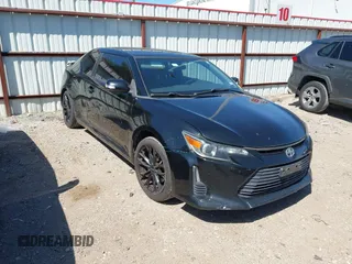 2015 Scion tC z VIN JTKJF5C76F3089937, wystawiony jako IAAI lot #41976035 z przebiegiem 146 752 mil mil oraz . Historia ofert i sprzedaży dostępna na DreamBid. Obrazek 1.