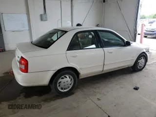 1999 Mazda Protege DX z VIN JM1BJ2224X0173126, wystawiony jako Copart lot #57389245 z przebiegiem 155 534 mil mil oraz Szkoda całkowita • Salvage title. Historia ofert i sprzedaży dostępna na DreamBid. Obrazek 3.