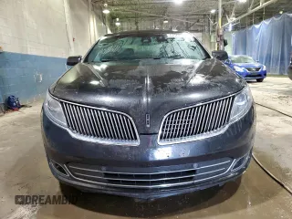 2014 Lincoln MKS z VIN 1LNHL9DK7EG610823, wystawiony jako Copart lot #47544585 z przebiegiem 131 176 mil mil oraz Czysty tytuł • Clean title. Historia ofert i sprzedaży dostępna na DreamBid. Obrazek 5.