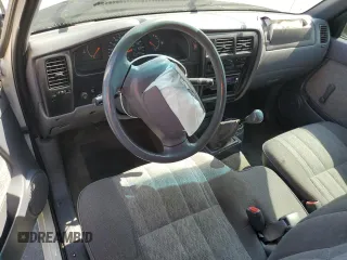 1999 Toyota Tacoma z VIN 4TAVL52N7XZ567598, wystawiony jako Copart lot #55141495 z przebiegiem 225 505 mil mil oraz Szkoda całkowita • Salvage title. Historia ofert i sprzedaży dostępna na DreamBid. Obrazek 8.