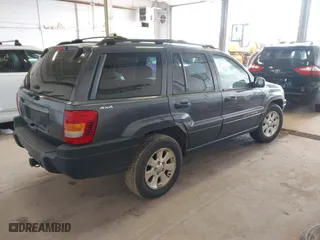 2001 Jeep Grand Cherokee Laredo with VIN 1J4GW48S91C525711, listed as a IAAI auction lot 42048952 with 1 mi miles. Bid and sale history available at carsss.com. Image 4.