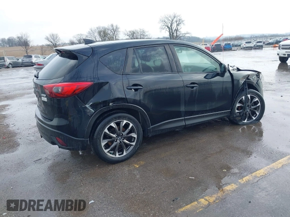 2016 Mazda CX-5 Grand Touring with VIN JM3KE4DY3G0769448, listed as a IAAI auction lot 41947725 with 154,051 mi miles and . Bid and sale history available at carsss.com. Image 4.