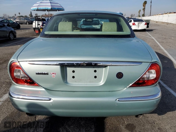 2005 Jaguar XJ with VIN SAJWA79C15SG47018, listed as a Copart auction lot 43087185 with 31,725 mi miles and Salvage Title. Bid and sale history available at carsss.com. Image 6.