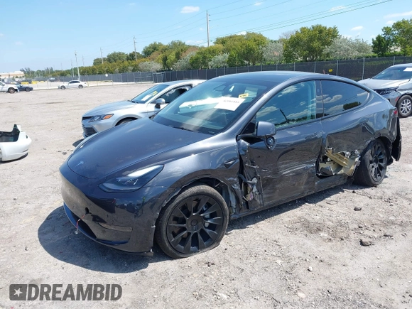 2024 Tesla Model Y with VIN 7SAYGDED3RF019063, listed as a IAAI auction lot 42061888 with 13,763 mi miles and . Bid and sale history available at DreamBid. Image 2.