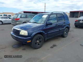 2003 Suzuki Grand Vitara z VIN JS3TE62VX34101877, wystawiony jako IAAI lot #42360315 z przebiegiem 171 207 mil mil oraz . Historia ofert i sprzedaży dostępna na DreamBid. Obrazek 2.