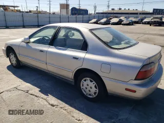 1996 Honda Accord Value with VIN 1HGCD5691TA249900, listed as a Copart auction lot 77683144 with 155,178 mi miles and Salvage Title. Bid and sale history available at DreamBid. Image 2.