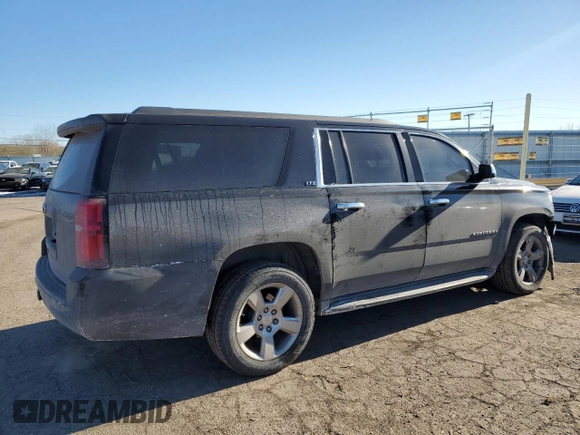 2015 Chevrolet Suburban LT with VIN 1GNSKJKC2FR274506, listed as a Copart auction lot 87881695 with 196,506 mi miles and Salvage Title. Bid and sale history available at DreamBid. Image 3.
