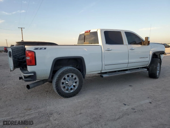 2015 GMC Sierra 2500HD available WiFi Denali with VIN 1GT120E82FF595114, listed as a Copart auction lot 77699494 with 189,891 mi miles and Salvage Title. Bid and sale history available at carsss.com. Image 3.