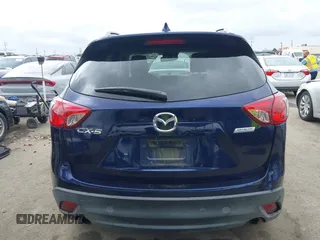 2014 Mazda CX-5 Grand Touring with VIN JM3KE2DY1E0307911, listed as a IAAI auction lot 42064898 with 133,934 mi miles. Bid and sale history available at carsss.com. Image 17.