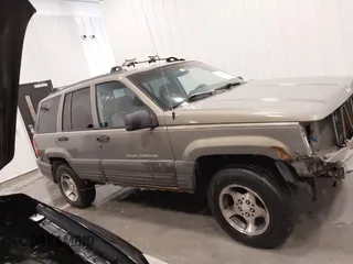 1997 Jeep Grand Cherokee Laredo with VIN 1J4GZ58S2VC746778, listed as a IAAI auction lot 41225925 with 196,679 mi miles. Bid and sale history available at carsss.com. Image 14.