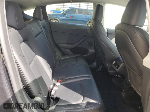 2025 Tesla Model Y Long Range with VIN 7SAYGAEEXSF253326, listed as a Copart auction lot 49527965 with 5,803 mi miles and Salvage Title. Bid and sale history available at DreamBid. Image 12.