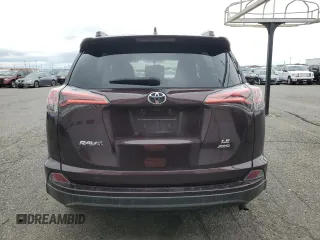 2016 Toyota RAV4 LE with VIN 2T3BFREV3GW490181, listed as a Copart auction lot 52457435 with 128,267 mi miles and Salvage Title. Bid and sale history available at DreamBid. Image 6.