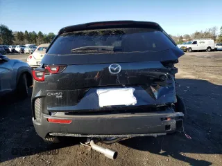 2024 Mazda CX-50 S Premium with VIN 7MMVABDM9RN233239, listed as a Copart auction lot 50028865 with 10,584 mi miles and Salvage Title. Bid and sale history available at DreamBid. Image 6.