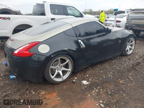 2009 Nissan 370Z Touring with VIN JN1AZ44E69M404341, listed as a IAAI auction lot 41907551 with 144,612 mi miles and . Bid and sale history available at DreamBid. Image 4.