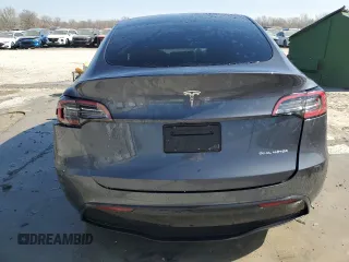 2023 Tesla Model Y Long Range z VIN 7SAYGDEE7PF822934, wystawiony jako Copart lot #49285285 z przebiegiem Nie podano mil oraz Szkoda całkowita • Salvage title. Historia ofert i sprzedaży dostępna na DreamBid. Obrazek 6.