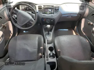 2009 Kia Rio LX with VIN KNADE223296539006, listed as a Copart auction lot 69229394 with 227,766 mi miles and Salvage Title. Bid and sale history available at DreamBid. Image 8.