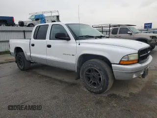 2002 Dodge Dakota SLT z VIN 1B7HL48N22S636413, wystawiony jako Copart lot #47884475 z przebiegiem 226 723 mil mil oraz Czysty tytuł • Clean title. Historia ofert i sprzedaży dostępna na DreamBid. Obrazek 4.