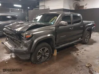 2018 Toyota Tacoma SR with VIN 3TMCZ5AN9JM135891, listed as a IAAI auction lot 41551990 with 80,235 mi miles. Bid and sale history available at carsss.com. Image 2.