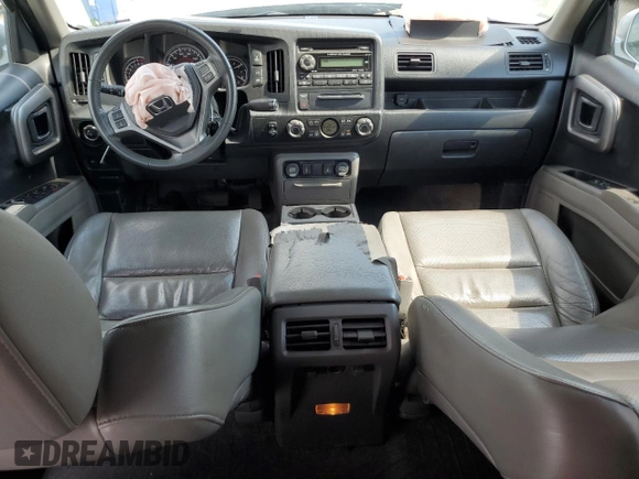 2014 Honda Ridgeline RTL with VIN 5FPYK1F57EB002835, listed as a Copart auction lot 54748905 with 111,253 mi miles and Salvage title. Bid and sale history available at DreamBid. Image 8.