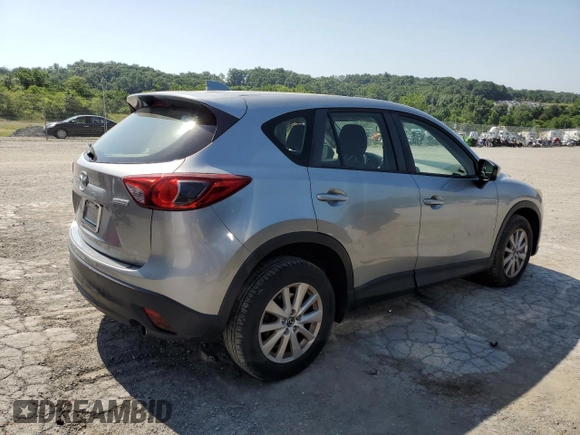 2014 Mazda CX-5 Sport with VIN JM3KE2BE7E0334880, listed as a Copart auction lot 61780635 with 96,926 mi miles and Salvage title. Bid and sale history available at DreamBid. Image 3.
