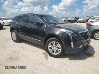 2024 Cadillac XT5 FWD Luxury with VIN 1GYKNAR42RZ731988, listed as a Copart auction lot 72777544 with 5,965 mi miles and Salvage title. Bid and sale history available at DreamBid. Image 4.