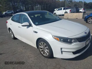 2016 Kia Optima EX with VIN 5XXGU4L32GG070138, listed as a IAAI auction lot 42138810 with 131,040 mi miles. Bid and sale history available at carsss.com. Image 1.