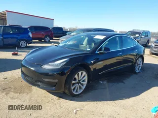 2018 Tesla Model 3 Long Range Battery with VIN 5YJ3E1EA2JF014975, listed as a IAAI auction lot 41319407 with 106,301 mi miles and . Bid and sale history available at DreamBid. Image 17.