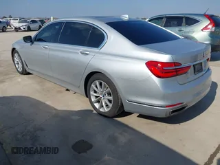 2016 BMW 7 Series 740i with VIN WBA7E2C5XGG739099, listed as a IAAI auction lot 41526038 with 123,900 mi miles. Bid and sale history available at carsss.com. Image 3.