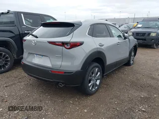 2025 Mazda CX-30 S Preferred with VIN 3MVDMBCM7SM771411, listed as a IAAI auction lot 41290560 with 4 mi miles and . Bid and sale history available at DreamBid. Image 4.