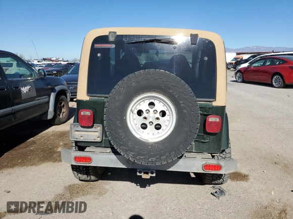 1997 Jeep Wrangler Sahara with VIN 1J4FY49S6VP521988, listed as a Copart auction lot 80753494 with 99,909 mi miles and Salvage Title. Bid and sale history available at carsss.com. Image 6.