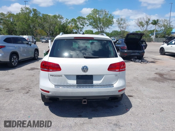 2012 Volkswagen Touareg Sport with VIN WVGEF9BP1CD008717, listed as a IAAI auction lot 42120641 with 211,580 mi miles and . Bid and sale history available at DreamBid. Image 16.