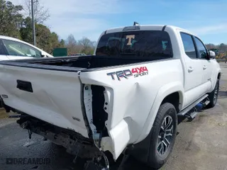 2020 Toyota Tacoma 4WD SR5 with VIN 3TMCZ5AN3LM309635, listed as a IAAI auction lot 41598363 with 99,080 mi miles. Bid and sale history available at carsss.com. Image 4.