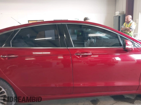 2016 Ford Fusion Titanium z VIN 3FA6P0K95GR119017, wystawiony jako IAAI lot #42148460 z przebiegiem 84 770 mil mil oraz . Historia ofert i sprzedaży dostępna na DreamBid. Obrazek 13.