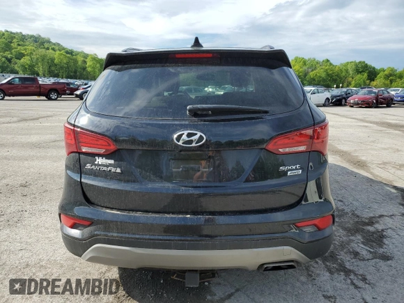 2017 Hyundai Santa Fe 2.4L z VIN 5XYZUDLB1HG412675, wystawiony jako Copart lot #57169045 z przebiegiem 38 947 mil mil oraz Szkoda całkowita • Salvage title. Historia ofert i sprzedaży dostępna na DreamBid. Obrazek 6.