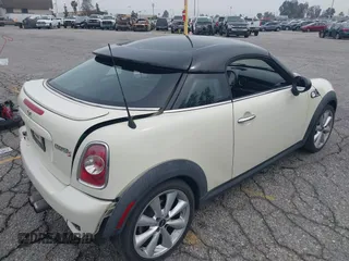 2013 MINI Coupe S with VIN WMWSX3C53DT466648, listed as a IAAI auction lot 41719597 with 106,936 mi miles and . Bid and sale history available at DreamBid. Image 4.