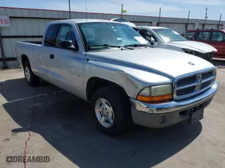 2002 Dodge Dakota SLT with VIN 1B7GL42X72S582306, listed as a IAAI auction lot 41823338 with 163,455 mi miles. Bid and sale history available at carsss.com. Image 1.