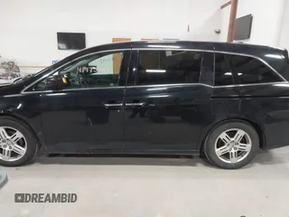 2011 Honda Odyssey Touring с VIN 5FNRL5H9XBB055008, выставлен на аукционе IAAI как лот 41973447 с пробегом 218 762 миль миль и . История ставок и продаж доступна на DreamBid. Изображение 14.