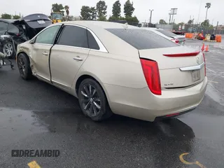 2013 Cadillac XTS z VIN 2G61N5S32D9127146, wystawiony jako IAAI lot #41578528 z przebiegiem 98 529 mil mil oraz . Historia ofert i sprzedaży dostępna na DreamBid. Obrazek 3.