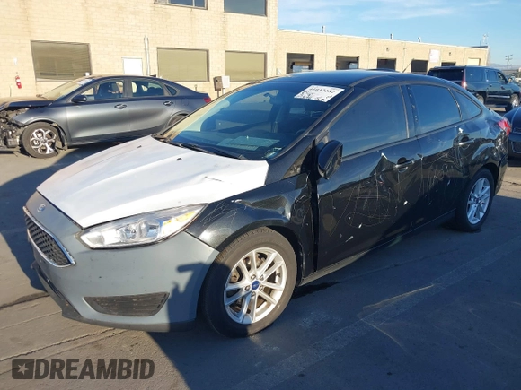 2015 Ford Focus SE with VIN 1FADP3F29FL350473, listed as a IAAI auction lot 41032182 with 102,898 mi miles. Bid and sale history available at carsss.com. Image 2.