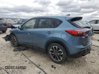 2016 Mazda CX-5 Grand Touring z VIN JM3KE4DY2G0637779, wystawiony jako Copart lot #52001805 z przebiegiem 184 381 mil mil oraz Czysty tytuł • Clean title. Historia ofert i sprzedaży dostępna na DreamBid. Obrazek 2.
