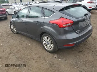 2017 Ford Focus Titanium z VIN 1FADP3N29HL240527, wystawiony jako Copart lot #62891695 z przebiegiem 126 926 mil mil oraz Szkoda całkowita • Salvage title. Historia ofert i sprzedaży dostępna na DreamBid. Obrazek 2.