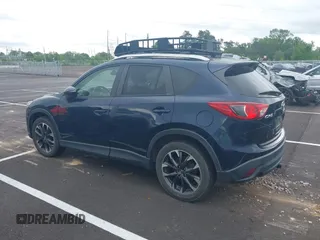 2016 Mazda CX-5 Grand Touring with VIN JM3KE2DYXG0890174, listed as a IAAI auction lot 42157884 with 141,873 mi miles. Bid and sale history available at carsss.com. Image 14.