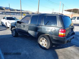 1998 Jeep Grand Cherokee Limited with VIN 1J4GX78Y8WC110325, listed as a IAAI auction lot 41357373 with 165,106 mi miles. Bid and sale history available at carsss.com. Image 3.