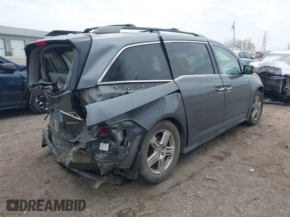 2012 Honda Odyssey Touring with VIN 5FNRL5H99CB028304, listed as a IAAI auction lot 42031916 with 216,185 mi miles and . Bid and sale history available at DreamBid. Image 4.