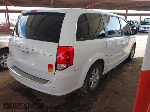 2012 Dodge Grand Caravan SE with VIN 2C4RDGBGXCR407641, listed as a IAAI auction lot 41950812 with 151,331 mi miles and . Bid and sale history available at DreamBid. Image 4.