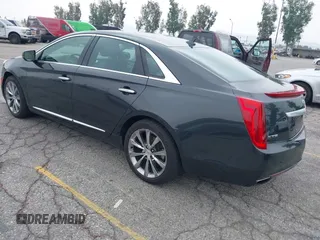 2013 Cadillac XTS Luxury with VIN 2G61P5S33D9215214, listed as a IAAI auction lot 42170402 with 132,045 mi miles and . Bid and sale history available at DreamBid. Image 3.