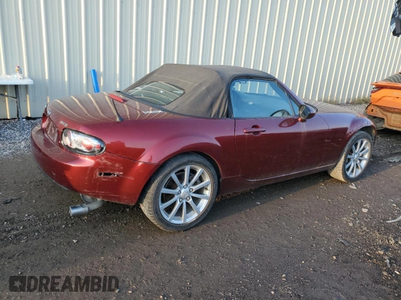 2007 Mazda MX-5 Miata Sport z VIN JM1NC25F970124896, wystawiony jako Copart lot #83624394 z przebiegiem 62 735 mil mil oraz Szkoda całkowita • Salvage title. Historia ofert i sprzedaży dostępna na DreamBid. Obrazek 3.