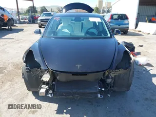 2019 Tesla Model 3 Long Range with VIN 5YJ3E1EB9KF231742, listed as a IAAI auction lot 42114608 with 86,657 mi miles and . Bid and sale history available at DreamBid. Image 13.