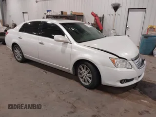 2010 Toyota Avalon XL with VIN 4T1BK3DB9AU358803, listed as a IAAI auction lot 41072257 with 157,185 mi miles and . Bid and sale history available at DreamBid. Image 1.